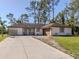 Single story home exterior with attached garage and landscaping at 3331 Traverse Ave, North Port, FL 34286