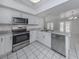 Open kitchen boasting stainless steel appliances and granite countertops at 3331 Traverse Ave, North Port, FL 34286