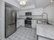 Bright kitchen with stainless steel appliances and granite countertops at 3331 Traverse Ave, North Port, FL 34286