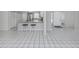 Kitchen features a breakfast bar, stainless steel appliances, and white tile flooring at 3331 Traverse Ave, North Port, FL 34286
