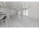 Open living room with tile floors and access to the backyard at 3331 Traverse Ave, North Port, FL 34286