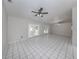 Bright and airy living room with tile floors and french doors at 3331 Traverse Ave, North Port, FL 34286