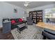 Living room featuring a sofa, bookcase, and coffee table at 3331 Traverse Ave, North Port, FL 34286