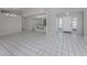 Open floor plan features a kitchen and a living room with tile floor at 3331 Traverse Ave, North Port, FL 34286