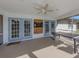 Relaxing screened porch with dartboard and outdoor seating at 3331 Traverse Ave, North Port, FL 34286