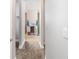 Clean bathroom hallway with access to closets and bathroom at 3390 Dover Dr, Punta Gorda, FL 33983