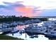Peaceful sunset over a marina filled with boats at 3390 Dover Dr, Punta Gorda, FL 33983