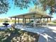 Community picnic pavilion with tables, grills, and trash cans at 3390 Dover Dr, Punta Gorda, FL 33983