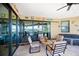 Covered patio with seating area, overlooking pool and canal at 3390 Dover Dr, Punta Gorda, FL 33983