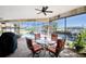 Covered patio with seating area, overlooking the pool and canal at 3390 Dover Dr, Punta Gorda, FL 33983