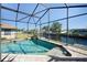 Relaxing pool area with canal view and screened enclosure at 3390 Dover Dr, Punta Gorda, FL 33983