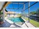 Relaxing pool area with screened enclosure offering waterfront views at 3390 Dover Dr, Punta Gorda, FL 33983