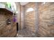 Large walk-in shower with pebble floor and wood-look tile at 3390 Dover Dr, Punta Gorda, FL 33983