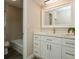 Updated bathroom with white vanity and walk-in shower at 352 Gardenia Rd, Venice, FL 34293