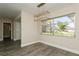 Cozy dining area with large window and modern light fixture at 352 Gardenia Rd, Venice, FL 34293