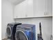 Laundry room with washer, dryer, and additional cabinets at 4008 Via Sienna Cir, Sarasota, FL 34243