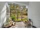 Relaxing screened patio with brick flooring and lush greenery at 4008 Via Sienna Cir, Sarasota, FL 34243