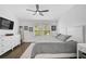 Main bedroom with king-size bed, large windows, and ample closet space at 4008 Via Sienna Cir, Sarasota, FL 34243