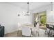 Bright dining area with table, chairs, and access to a screened patio at 4008 Via Sienna Cir, Sarasota, FL 34243
