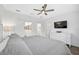 Main bedroom with king-size bed, TV, and built-in dresser at 4008 Via Sienna Cir, Sarasota, FL 34243