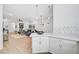 Modern kitchen with white cabinets, stainless steel appliances and a breakfast bar at 4008 Via Sienna Cir, Sarasota, FL 34243