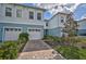 Two story light blue home with attached garage at 4008 Via Sienna Cir, Sarasota, FL 34243