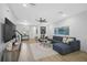Bright living room with hardwood floors, sectional sofa, and large artwork at 4008 Via Sienna Cir, Sarasota, FL 34243