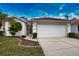 Front view of a single-story house with a two-car garage at 4378 Summertree Rd, Venice, FL 34293