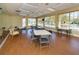 Bright community room with tables and chairs, perfect for gatherings at 588 Sawgrass Bridge Rd, Venice, FL 34292