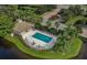 Relaxing community pool with ample lounge chairs and a covered patio at 900 San Lino Cir # 922, Venice, FL 34292
