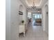 Elegant entryway with tiled floors and decorative console table at 900 San Lino Cir # 922, Venice, FL 34292