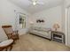 Relaxing bedroom with a sofa and rocking chair, near balcony at 900 San Lino Cir # 922, Venice, FL 34292