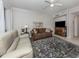 Cozy living room with light leather couches and a large TV at 900 San Lino Cir # 922, Venice, FL 34292