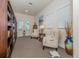 Cozy library with comfortable chairs and extensive bookshelves at 900 San Lino Cir # 922, Venice, FL 34292