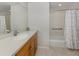 Clean bathroom with a single vanity, shower/tub combo at 900 San Lino Cir # 922, Venice, FL 34292