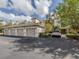 Condo building with multiple attached garages and landscaping at 900 San Lino Cir # 922, Venice, FL 34292