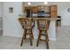 Kitchen with granite countertops and wood cabinets at 900 San Lino Cir # 922, Venice, FL 34292