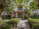Landscaped walkway leading to building entrance, with pergola at 900 San Lino Cir # 922, Venice, FL 34292