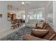 Bright living room with comfy sofas and access to the dining area at 900 San Lino Cir # 922, Venice, FL 34292