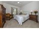 Charming bedroom with a queen-size bed and a comfortable armchair at 900 San Lino Cir # 922, Venice, FL 34292