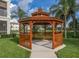 Wooden gazebo overlooking a lake, perfect for relaxing at 900 San Lino Cir # 922, Venice, FL 34292