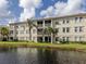 Exterior view of condo building by water at 900 San Lino Cir # 922, Venice, FL 34292
