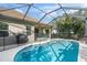 Relaxing pool area with screened enclosure at 12261 Stuart Dr, Venice, FL 34293