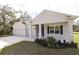 One-story home with attached garage and covered porch at 15467 Maynard Ave, Port Charlotte, FL 33953