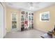 Bedroom with built-in shelving, window and ceiling fan at 196 Stanford Rd, Venice, FL 34293