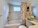 Clean bathroom with shower/tub and floral shower curtain at 210 Park N Blvd # 129, Venice, FL 34285