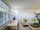 Bright living room with a comfy sofa and a convenient workspace at 210 Park N Blvd # 129, Venice, FL 34285