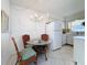 Bright kitchen with white cabinets, appliances, and a breakfast nook at 210 Park N Blvd # 129, Venice, FL 34285