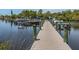 Wooden boat docks stretching over calm water at 271 Captains Ct, North Port, FL 34287