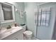 Clean bathroom with white vanity, shower, and updated fixtures at 340 Blackburn Blvd, North Port, FL 34287